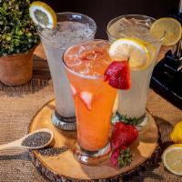 Fresh Squeezed Strawberry Lemonade (20 Oz) · After squeezing lemons to get fresh juice, we blend it with fresh strawberries to make a del...
