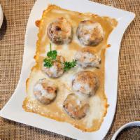 Mushrooms Gratinati · Stuffed mushrooms with crab meat and ricotta cheese. Baked in the oven with a sweet Marsala ...