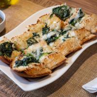Little Rome Homemade Bread · French bread topped with garlic, butter and melted provolone cheese, showered with a creamy ...
