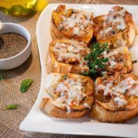 Bruschetta · Slide bread topped with fresh chopped tomato, basil, garlic, virgin olive oil. Baked with a ...