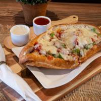 Sausage And Peppers Parmegiana · Lean sliced Italian sausage with grilled peppers and onions along with our signature homemad...