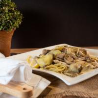 Chicken Castellini · Chicken breast sautéed with fresh mushrooms and artichoke hearts served with our signature w...