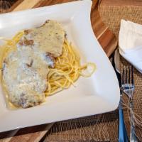 Veal Cremora · Thin breaded fried veal along with our heavy alfredo sauce topped with melted mozzarella che...