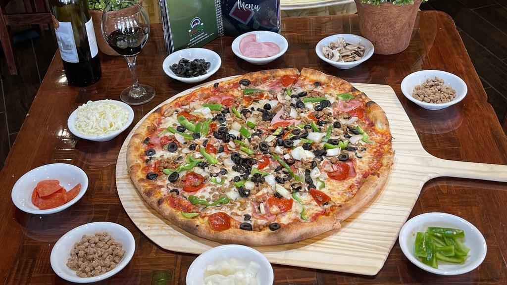 Supreme · Premium pepperoni, sausage, Canadian bacon, hamburger, mushrooms, black olives, onions and bell peppers.