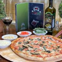 Margherita Pizza · Basil, fresh tomatoes, garlic and virgin olive oil.
