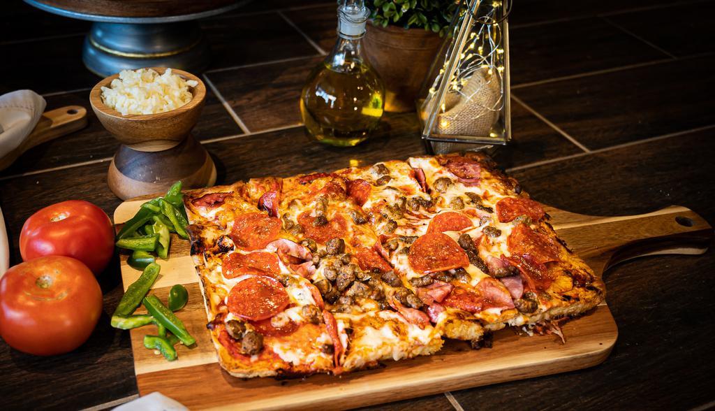 Deep Dish Meat Lovers Pizza · Hamburger, premium pepperoni, Canadian Sausage bacon and Italian sausage.