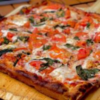 Deep Dish Margherita Pizza · Basil, Fresh tomatoes, garlic and virgin olive oil.