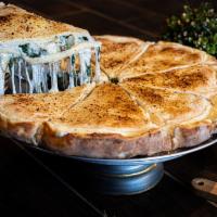 Spinach Stuffed Pizza · Sautéed fresh spinach, onions,mushrooms and mozzarella cheese with our original ricotta and ...