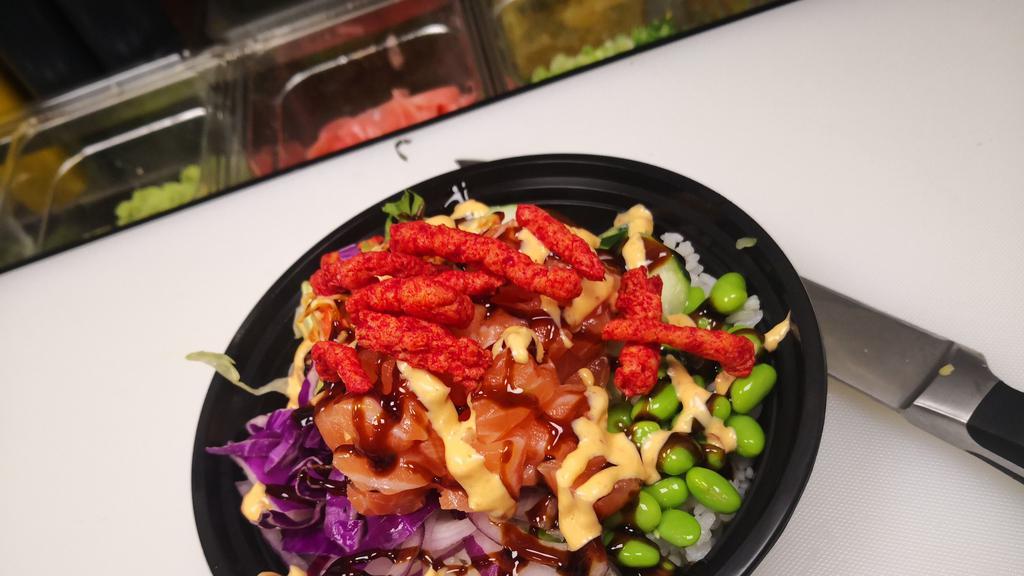 Ito Classic · salmon lettuce cucumber edamame red cabbage scallion crab salad ,eel sauce and spicy mayo,hot cheetos on top.