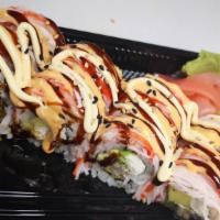 Flaming Roll · Shrimp tempura avocado cream cheese inside with imitation crab on top. Drizzled with eel sau...