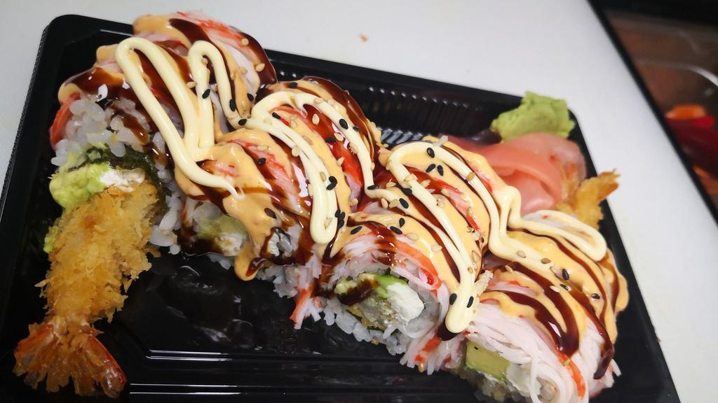 Flaming Roll · Shrimp tempura avocado cream cheese inside with imitation crab on top. Drizzled with eel sauce, spicy mayo and white mayo.