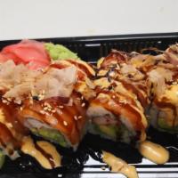 Yammy Yammy Roll · Imitation crab, avocado, cucumber,  wrapped with salmon on top, Drizzled with eel sauce, spi...