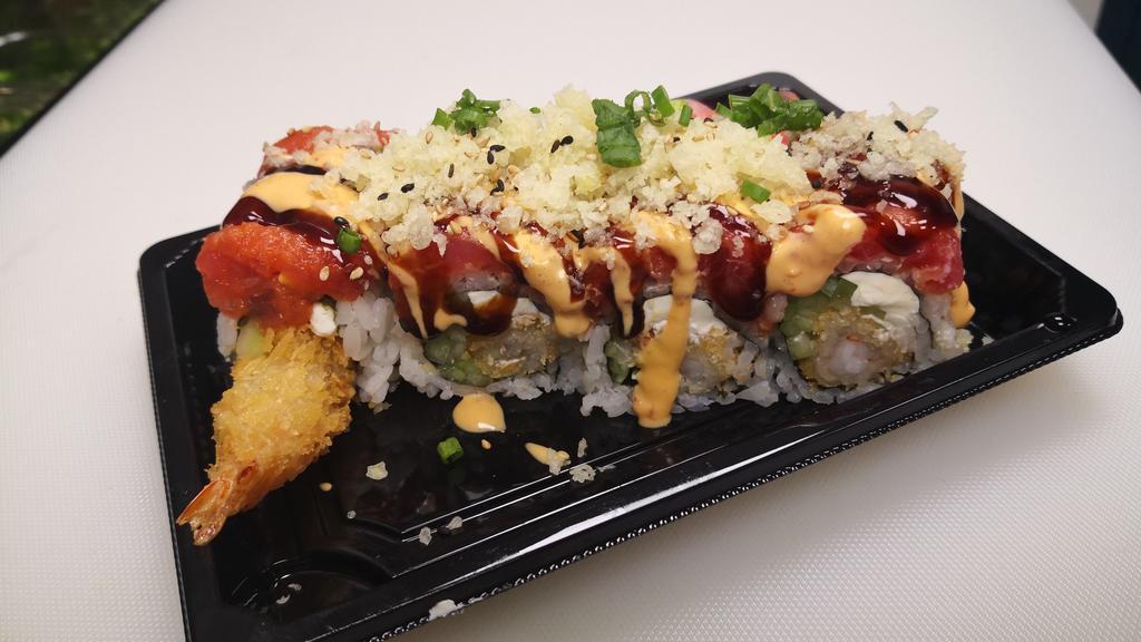 Ito Classic Roll · Shrimp tempura cucumber cream cheese inside wrapped  with spicy tuna, Drizzled with eel sauce and spicy mayo, green onion and crunch on top.