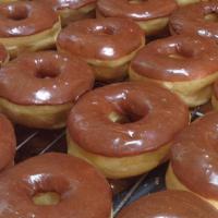 One Dozen Chocolate Iced Donuts +4 Extra Free  · One Dozen Chocolate Iced Donuts +4 EXTRA FREE