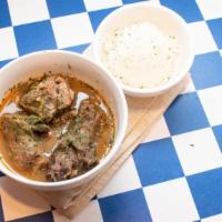 Turkey Necks · Slowly simmered turkey necks in our house broth. served with steamed rice.