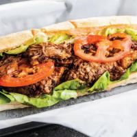 Beef Brisket Po' Boy · Slow-Roasted Beef Brisket Chopped and Served with Lettuce, Tomato, and Cajun Mayo