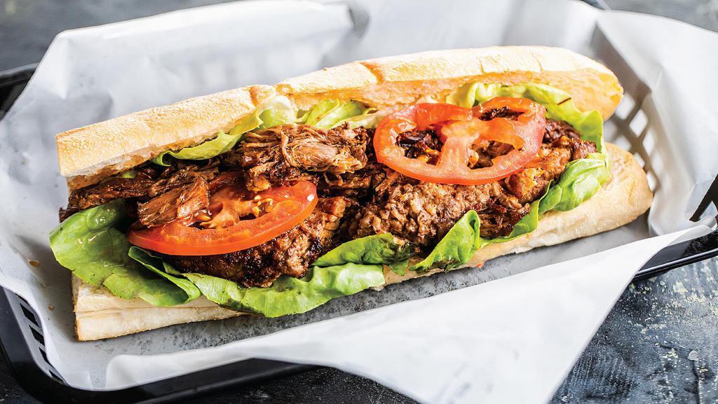 Beef Brisket Po'Boy · Slow-Roasted Beef Brisket Chopped and Served
with Lettuce, Tomato, and Cajun Mayo