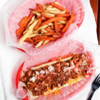 Grilled Foot Long Hot Dog · Topped with diced tomatoes, sliced onions, and shredded cheddar cheese. Served with fries.