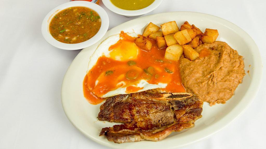 Pork Chop Plate · Two center-cut pork chops well cooked and topped with ranchero sauce.