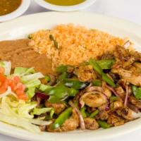 Monterrey Chicken Plate · Seasoned grilled chicken breast covered with spicy ranchero sauce and topped with white chee...
