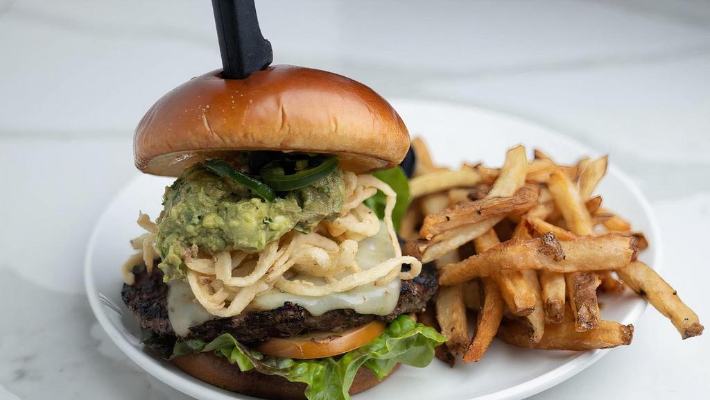 Jalapeno Pepperjack Burger · 1/2 lb. USDA choice lean ground beef patty prepared on a toasted pub bun spread with chipotle aioli. Served with melted pepper jack cheese,. sliced jalapeños, crispy fried Tabasco onion strings, guacamole, red leaf lettuce and sliced tomatoes.