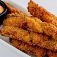 Freakin' Good Pickles · Crispy coated dill pickles, deep fried and served with Sriracha dipping sauce.