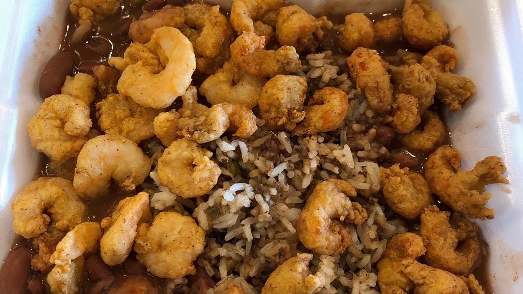 Cajun Bowl · Dirty Rice topped with red beans, crawfish tails or popcorn shrimp and our famous Cajun sauce