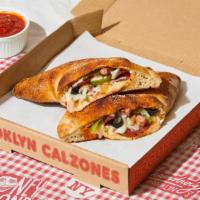 Fort Greene Calzone · Calzone with savory ham, salami, bell peppers, olives, melted provolone, and a side of marin...