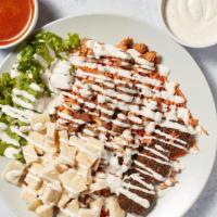 Manhattan Mix Plate · Freshly grilled mix of gyro and chicken cooked with onion, tomato, and peppers served over s...