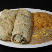 Carne Asada Burritos (2) · Inside burritos are guacamole, pico de gallo, and rice and beans on the side.