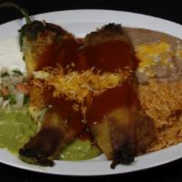 Chilis Rellenos (2) · At the bottom is guacamole, sour cream, lettuce, and pico de gallo on top of Rellenos is sal...