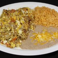 Machaca Plate · Shredded beef mixed with bell peppers, onions, tomatoes, egg, cheese, and rice and beans on ...