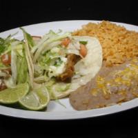 Fish Tacos (2) · Tacos come with pico de gallo, lettuce and tartar sauce and rice and beans on the side.