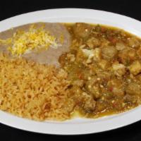Chicharrón · Pork skins soaked in salsa with cilantro and onions, and rice and beans on the side. Your ch...