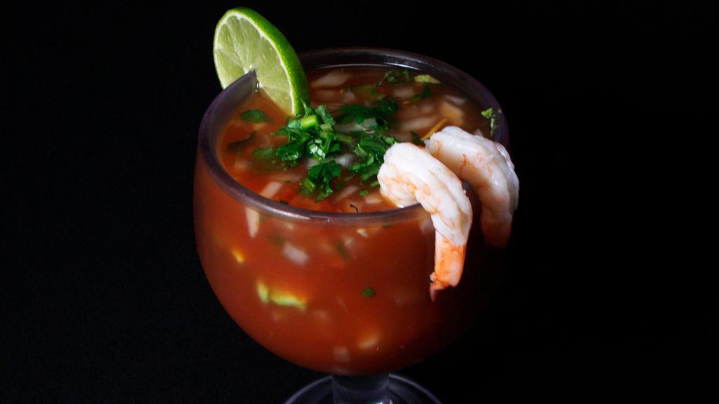 Shrimp Cocktail · Shrimps, pico de gallo, and avocado slices.