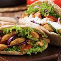 Chicken Kebab Wrap · Grilled chicken with grilled veggies and house sauce.