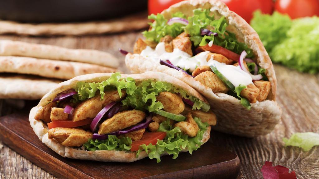 Chicken Kebab Wrap · Grilled chicken with grilled veggies and house sauce.