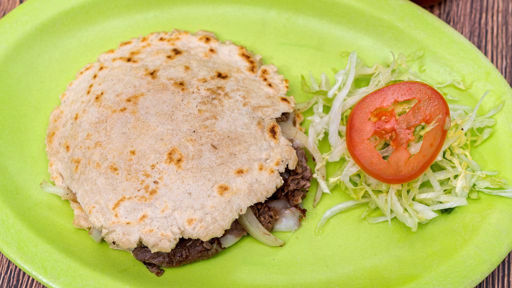 Gorditas · The meat of your choice, mozzarella cheese, refried bean, lettuce, sour cream, tomato, and avocado. Please leave note if you would like anything removed.