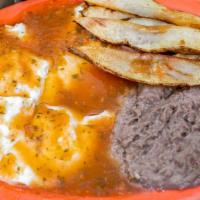 Huevos Rancheros · Three eggs with ranchero sauce on top. Accompanied with fries and Refried beans.