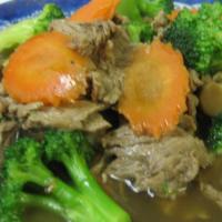 Broccoli Stir-Fry · Sauteed choice of protein with straw mushroom,  broccoli and carrot; stir-fried in brown sau...