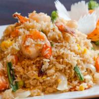 Thai Fried Rice · Thai fried rice with eggs, tomato, onion, carrot and green onion.