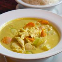 Yellow Curry · Slice meat in yellow curry with coconut milk, potato, carrot and onion.