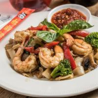 Pad Kee Mao · A choice of protein stir fried with flat rice noodles, bell pepper, broccoli, tomato, basil,...