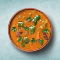 Wholesome Veggie Curry  · Fresh seasonal vegetables sautéed to perfection with herbs, ground spices, red onions and pe...