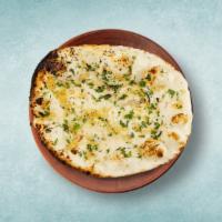 Garlic Naan  · Leavened refined wheat flatbread baked in a tandoor clay oven and topped with garlic.