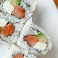 Alaskan Roll · Crab meat, avocado and cucumber inside, topped with fresh salmon and avocado.