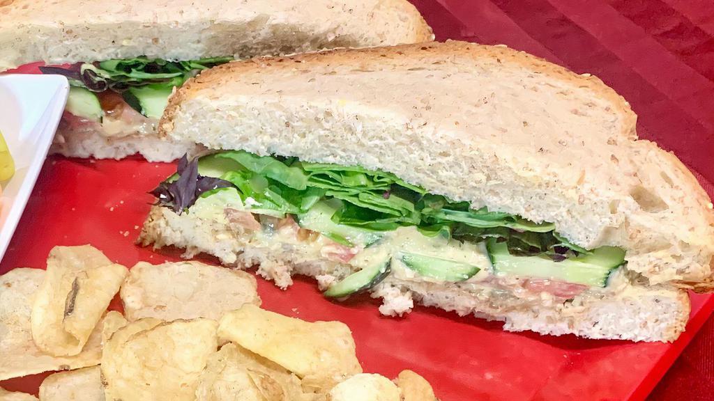 Hummus Peace · Hummus, Cucumbers, Spring Mix, Tomato, Capers, Dill, Sunflower Seeds, House Dressing on Wheat Bread. Served with chips & giardiniera.