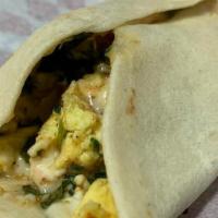 Mediterranean Taco · Eggs, Spinach, Feta, & Potatoes on a flour tortilla.