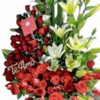 Unconditional Love · Consist if 7 lilies and 40 red roses with a vase.