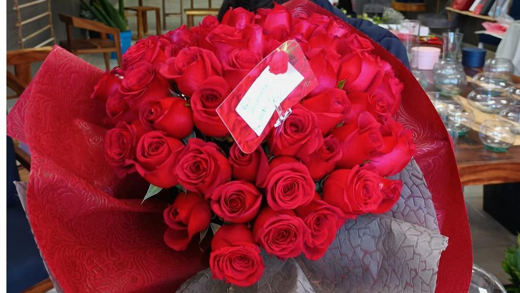 Red Roses Bouquet 50 · Comes with 50 red roses without a vase.